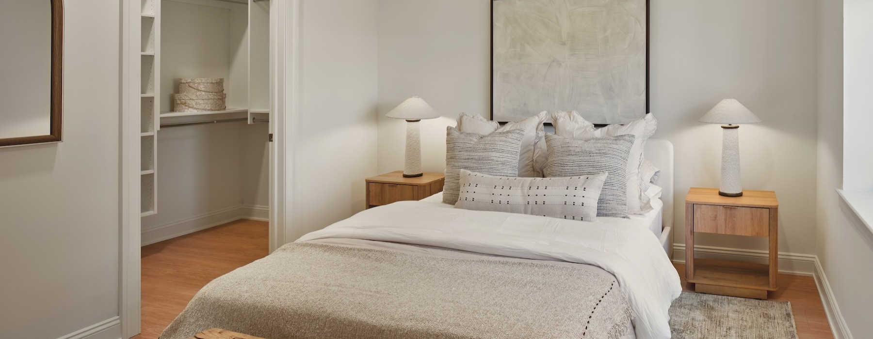 a bedroom with a bed and two nightstands
