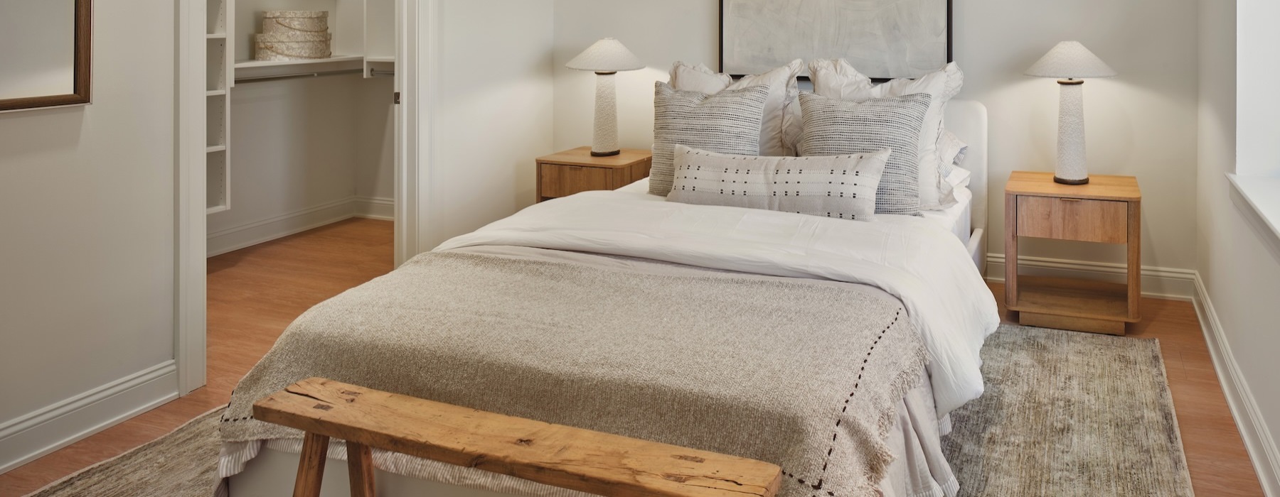 a bedroom with a bed and two nightstands