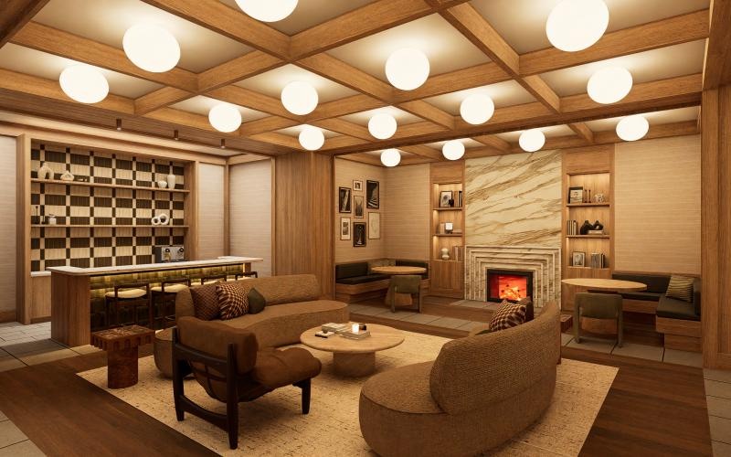 a clubroom with couches and a fireplace