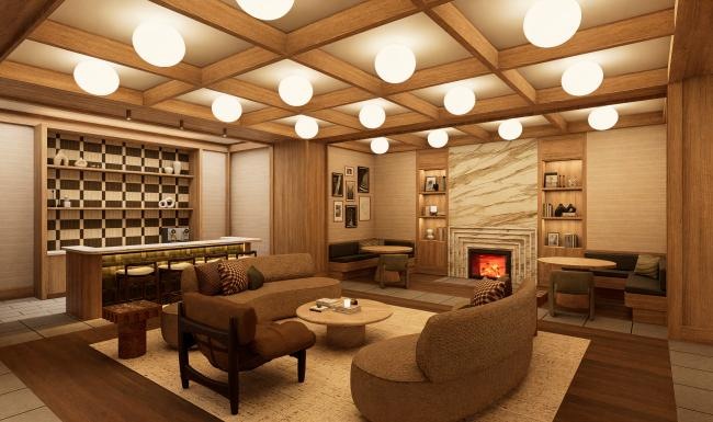 a clubroom with couches and a fireplace